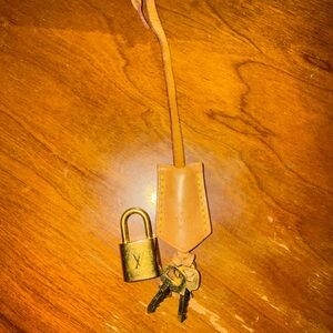Louis Vuitton Gold Padlock with Tan Leather Strap